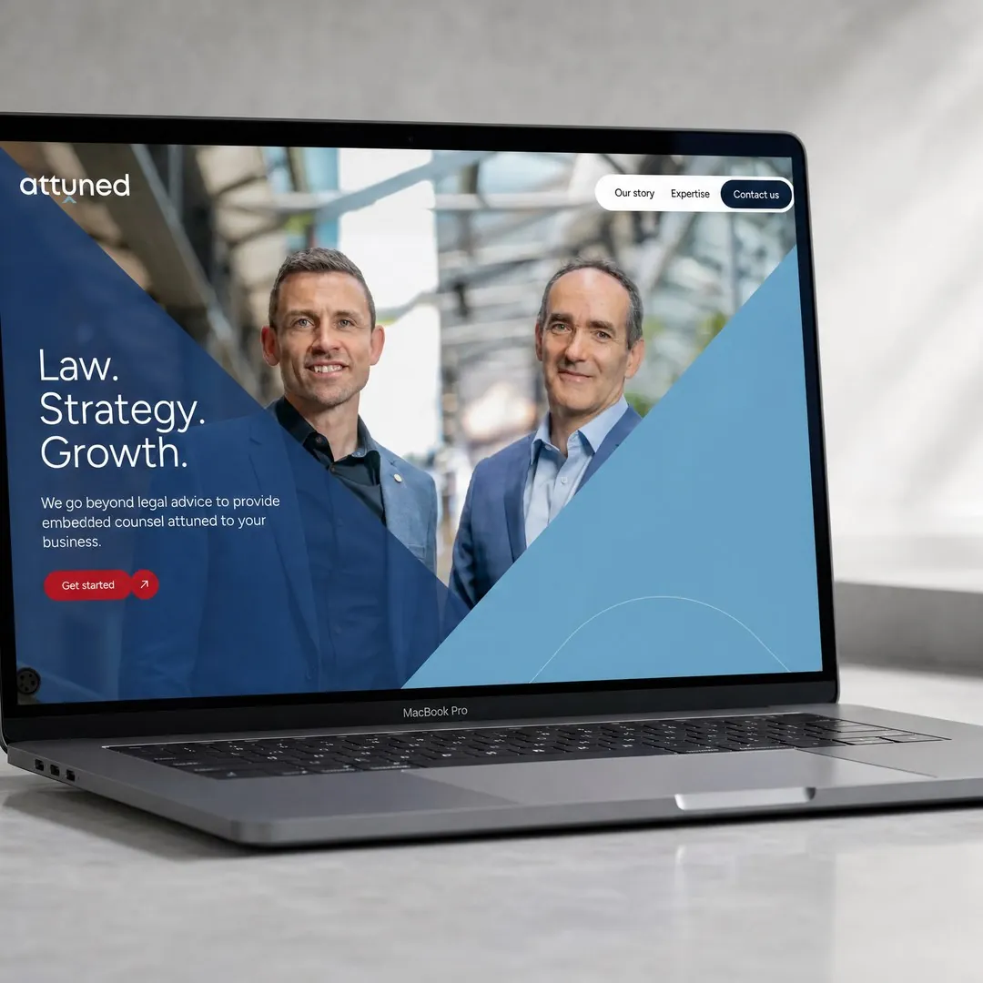 Attuned website header design by mtc., shown on a laptop.