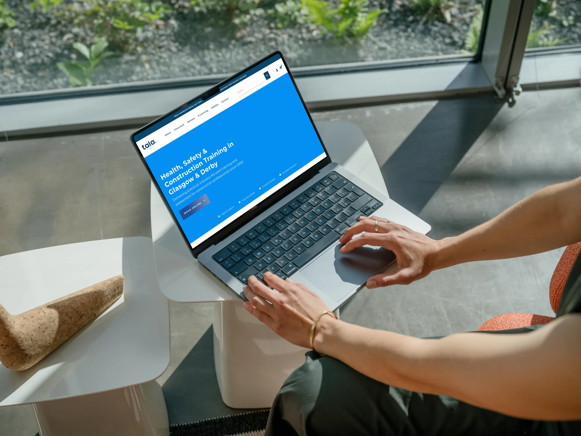 The Tala Training website on a laptop